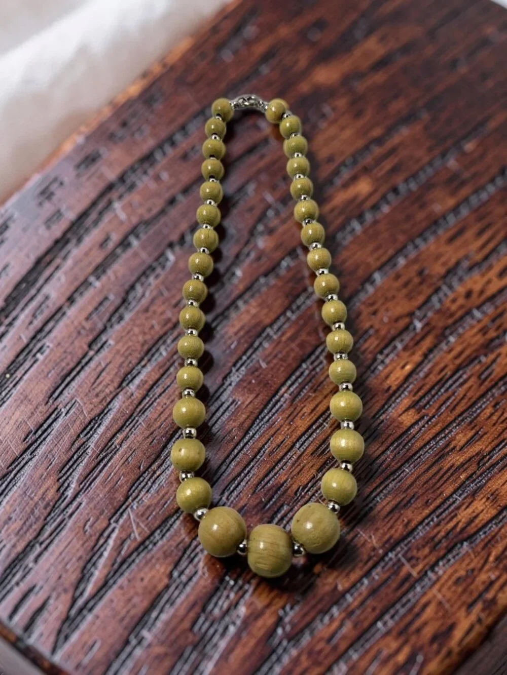 vintage polished olive wooden and silver metal beaded single row necklace